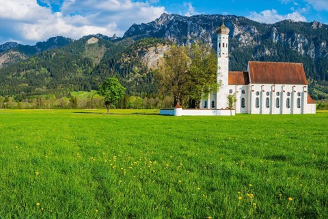 Baroque church of St. Coloman, behind it the Tegelberg mountain range, 1881m, Schwangau, Ostallgäu,