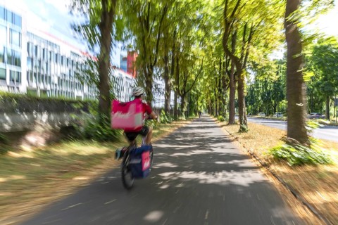 Cycling from a first-person perspective on a cycle path in Cologne, North Rhine-Westphalia,