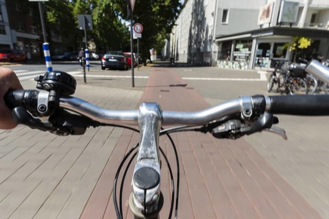 Cycling from a first-person perspective on a cycle path in Cologne, North Rhine-Westphalia,