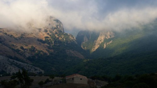 Fog, mountains, valley, green meadows, hut, light and shade, Madonie National Park, spring, Sicily,