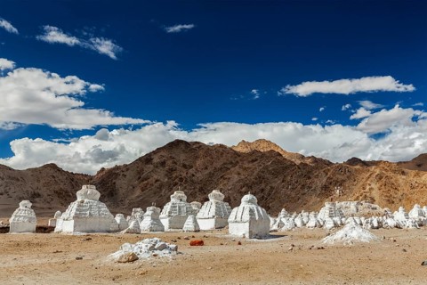 Whitewashed chortens (Tibetan Buddhist stupas) . Ladakh, Jammu and Kashmir, India, Asia