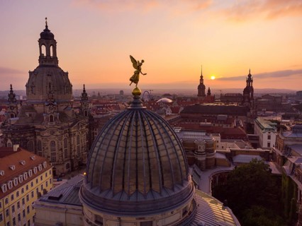 Dresden's old town from above.The glass dome of the Academy of Arts, crowned by a Fama figure,