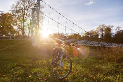 Symbolic image Resting on an e-bike tour in the Leipzig region in Grimma at the Mulde bridge