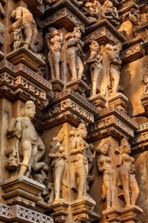 Stone carving bas relief sculptures on Vaman Temple, Khajuraho, Madhya Pradesh, India, Asia