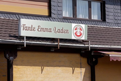 Abandoned grocery shop with sign corner shop, closed shutters, Düsseldorf, North Rhine-Westphalia,