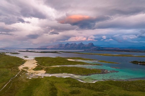 View of mountain range Seven Sisters from Herøy island, light mood, Helgeland coast, Nordland,