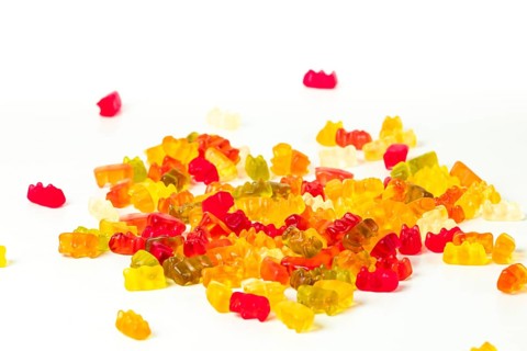 Different coloured gummy bears, on white