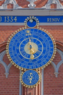 The astronomical clock with the signs of the zodiac, date and time on the façade of the Blackheads'