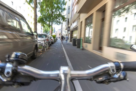 Cycling from a first-person perspective on a cycle path in Cologne, North Rhine-Westphalia,