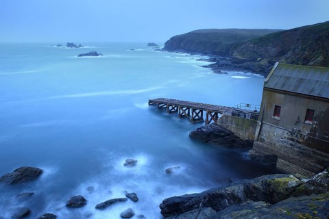 Abandoned boat ramp on rocky coast at dusk, mystical atmosphere, The Lizard, Cornwall, England,