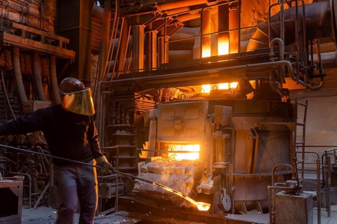 The Schmees foundry in Pirna, Germany, taking a sample of the molten metal, Europe