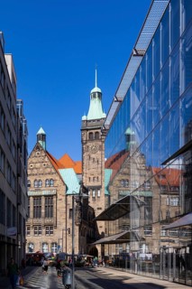 View through Bretgasse to the town hall with the reflection in Galeria Kaufhof