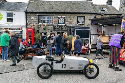 Traditional soapbox in front of crowd in town centre, Lafrowda Festival 2023, St Just in Penwith,