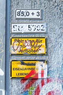 Signs defaced by sprayer on a wall, trespassing prohibited, Ulm, Baden-Württemberg, Germany, Europe