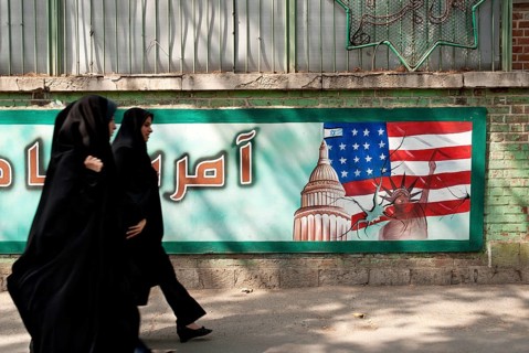 Anti american mural in tehran iran with veiled women