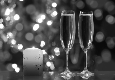 Glasses with champagne and candle, romantic evening
