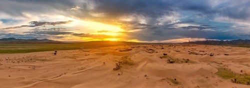 Aerial panorama view of the sand dunes Elsen Tasarhai (Bayan Gobi) desert at sunset in Mongolia