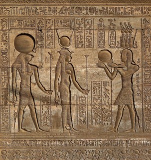 Hieroglyphic carvings on the exterior walls of an ancient egyptian temple