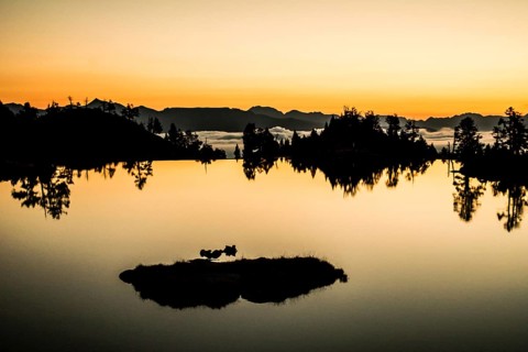 Sunrise lake in the Spanish Pyrenees, located at mountain hut JM Blanc, Aigüestortes i Estany de