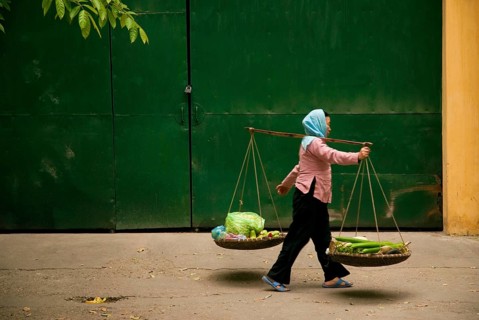 Central hanoi vietnam street woman food vendor