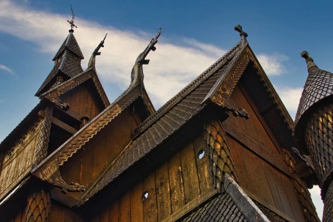 Close-up and detail of Norwegian wooden stave church roof and ornate. scandinavian architecture