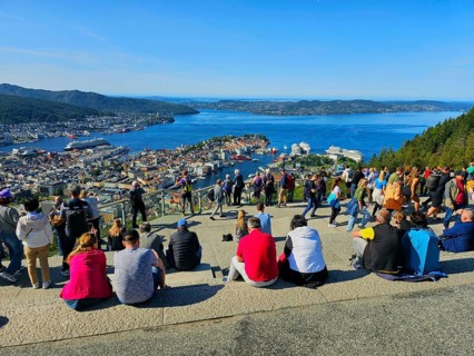 View of the city of Bergen with fjord, Bergen and a crowd of people admiring the scenery, Fløibanen
