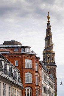 Historic houses, corkscrew-shaped tower of the Evangelical Lutheran Church of the Saviour, in front