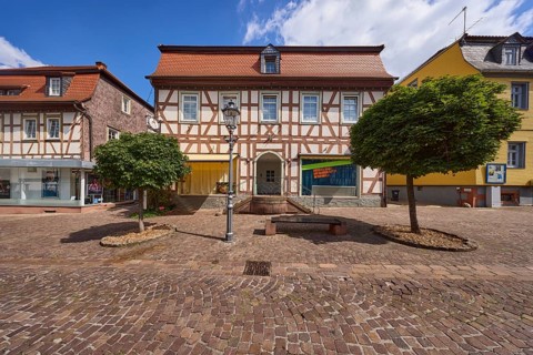 Half-timbered house with trees on Braunstraße in Michelstadt, Odenwald, Odenwaldkreis, Hesse,