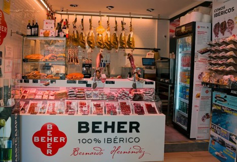 Butcher's shop with Spanish ham and other meat products in a traditional shop, Nerja, Province of