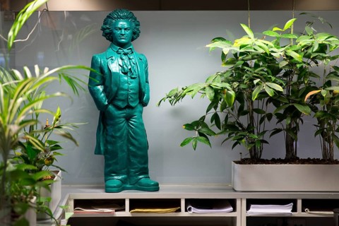Green Beethoven figure in the office amidst room palaces at the information desk in the town hall,