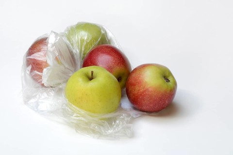 Apple in plastic bag, packaging