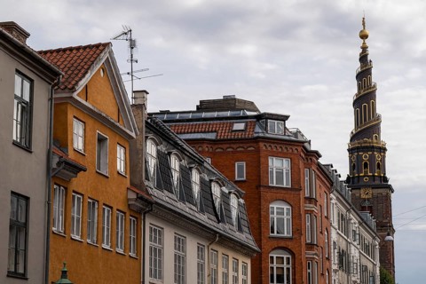 Historic houses, corkscrew-shaped tower of the Evangelical Lutheran Church of the Saviour, in front