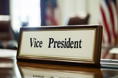 Desk sign with text 'Vice President' on desk in office. Generative Ai, AI generated