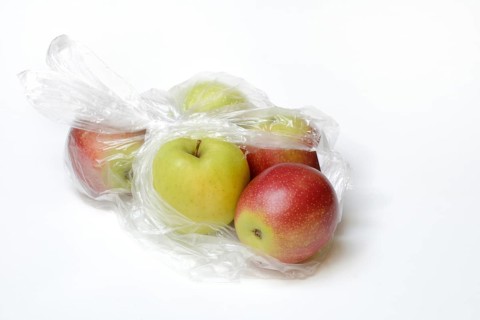 Apple in plastic bag, packaging