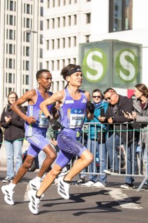 Dejene Megersa Ethiopia and Yohei Ikeda Japan on Potsdamer Platz at the 50th BMW Berlin Marathon