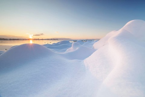 Snow hill on the lake at sunrise in winter, cool and calm colours, Seegarten, Allensbach, Lake