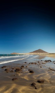 El medano tourist beach and montana roja famous landscape in tenerife spain