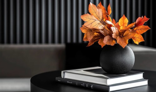 Sleek black table with a couple of books and a vase filled with autumn foliage AI generated