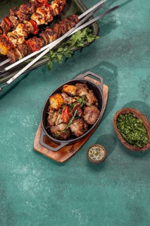 Food, Bbq grilled meat, pork, chicken and vegetable on cast iron pan. Grilled skewers on yellow