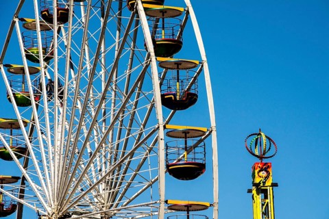 Bergen, Norway, May 2014: close-up and detail of colorful ferris wheel on blue sky, Europe