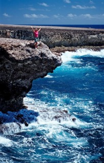 Woman watching surf on the coast, Netherlands Antilles, Bonaire, Caribbean, Caribbean Sea,