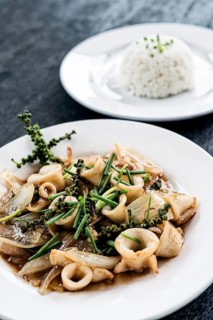 Fresh squid and kampot green pepper stir fry traditional asian cambodian seafood meal