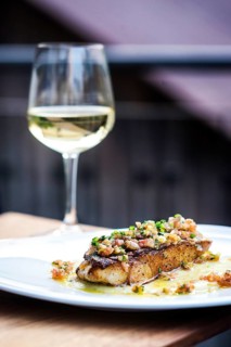 Sea bass fish with mexican tomato onion salsa sauce
