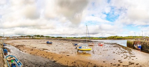 Panorama of the town and beached boats in the harbour at low tide, Garlieston, Dumfries & Galloway,