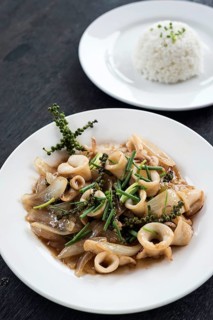 Fresh squid and kampot green pepper stir fry traditional asian cambodian seafood meal