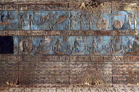 Hieroglyphic carvings and paintings on the interior walls of an ancient egyptian temple in Dendera