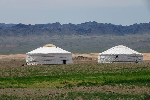 Traditional yurts between montains in Mongolia