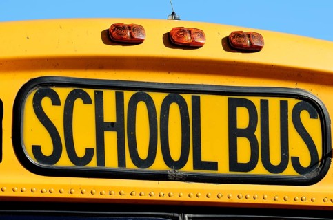 The front of a yellow school bus