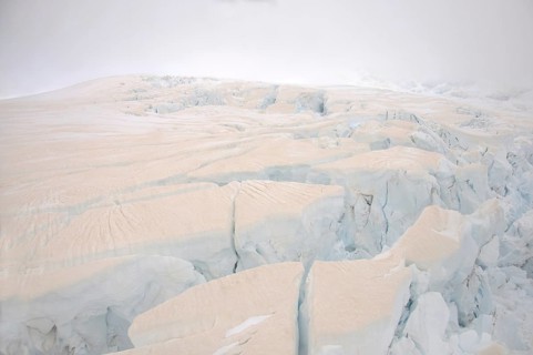 Franz Josef Glacier, Westland, New Zealand. Brown discolouration on the snow is smoke from