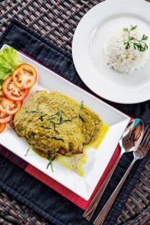 Thai fish fillet with asian green curry sauce meal and rice